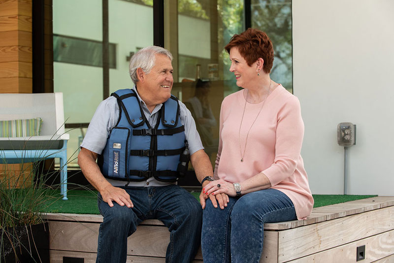 Man wearing AffloVest with Woman